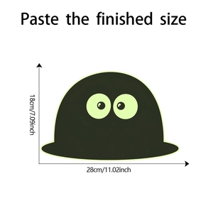 Detailed size view of black monster wall sticker with green glow accent, 28cm x 18cm