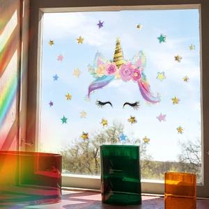 Rainbow suncatcher window sticker featuring a colorful unicorn and holographic stars deco