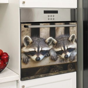 Magnetic oven cover featuring two sleeping raccoons on a wooden shelf in a cozy kitchen