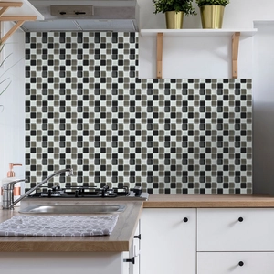Detail of grey and black mosaic oil-proof wall stickers applied on a kitchen backsplash