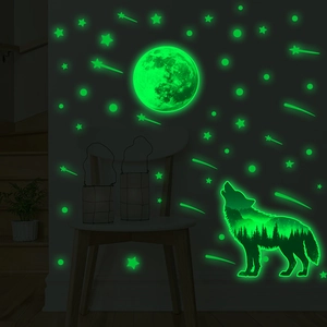 Glow in the dark wall stickers featuring forest wolf, moon, and stars in green neon