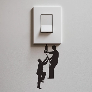 Detailed view of creative black silhouette climbing workers wall sticker for light switches