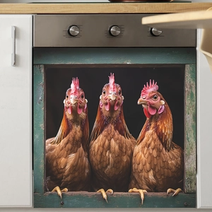 Close-up of funny three roosters sticker applied on a white kitchen oven door