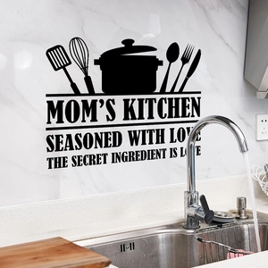 Kitchen wall decal featuring utensils and quote on a white marble backsplash surface