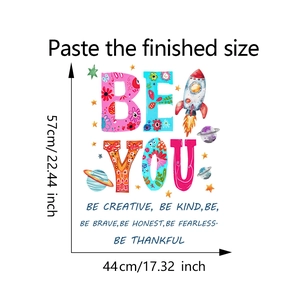 Detailed view of BE YOU wall sticker with colorful rocket and star patterns, 57x44cm size