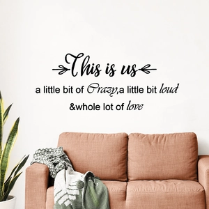 Minimalist 'This is us' wall sticker quote above a sofa for modern home office decor
