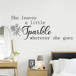 Minimalistischer Wandaufkleber Rose mit Spruch She leaves a little sparkle wherever she goes
