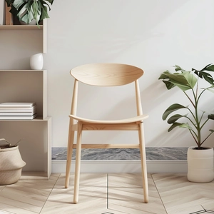 Minimalist light wood dining chair with curved backrest in a modern home interior setting