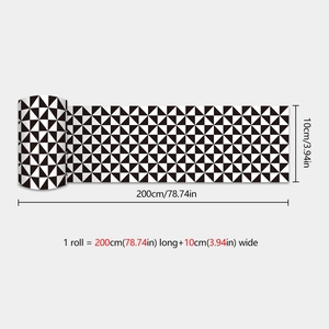 Detail view of self-adhesive wall sticker roll with black and white triangle pattern