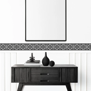 Detail of creative black and white mandala wall border stickers in a minimalist home decor setting