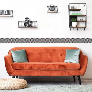 Modern black and white geometric triangle wall border sticker in a stylish living room