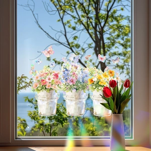 Colorful floral pot and butterfly static window decals on glass with natural outdoor view