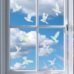 Rainbow bird window stickers with prismatic effect reflecting light on glass windows
