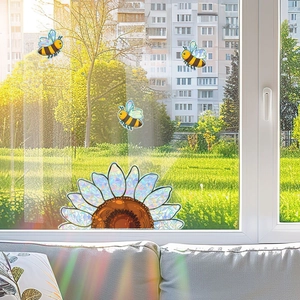 Sunflower and bee static window film creating rainbow light effects on a sunlit glass door
