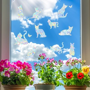 Holographic cat window stickers with rainbow prism effect on sunny glass background