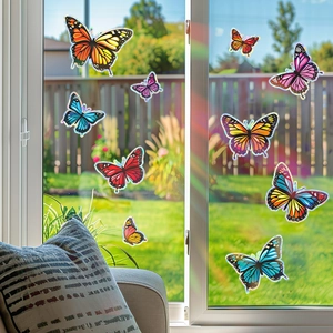 Colorful laser butterfly window clings creating rainbow diffraction in a sunlit room