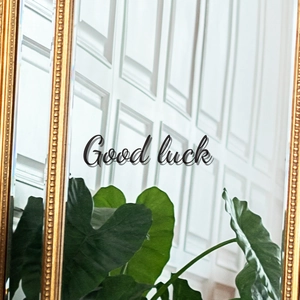 French vintage gold mirror with Good Luck inscription and detailed embossed floral frame