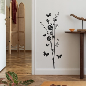 Modern black branch and butterfly wall decal for home decoration on white interior wall
