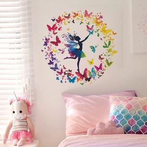 Dreamy wall decal featuring a ballerina silhouette with rainbow tutu and butterfly wreath