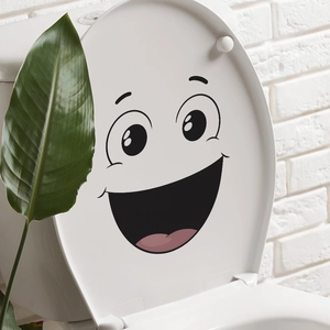 Creative smiling face decal for toilet seat decoration in minimalist bathroom setting