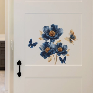 Vintage blue floral and butterfly wall decals on a white wooden door for home decor