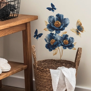 Blue peony and butterfly wall stickers on a minimalist wall above a wooden table