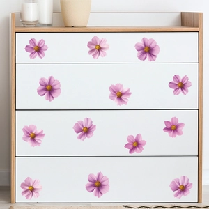 Pink cosmos flower wall decals applied to white dresser drawers for home decoration