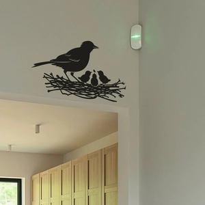 Sticker mural silhouette nid d'oiseau en PVC noir mat montrant des oiseaux se nourrissant