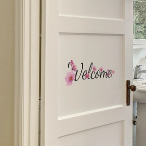 Welcome wall decal with pink cosmos flowers on a white bedroom door for home decoration