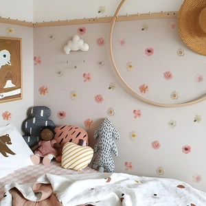 Floral wall decals featuring pink and white flower stickers for kids' bedroom decoration