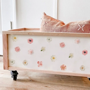 Floral DIY wall stickers featuring soft pink and white flowers on a wooden storage box