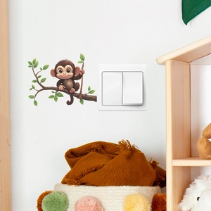 Sticker mural singe sur branche d'arbre pour déco chambre enfant près d'interrupteur