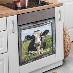 Magnetic dishwasher decal with a black and white cow on a blooming daisy field