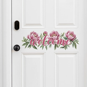Sticker mural fleurs de pivoines roses et message welcome sur une porte en bois blanc