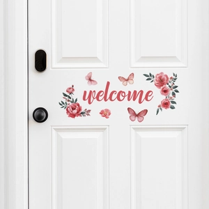 Pink butterfly and flower wall sticker with welcome lettering on a white door