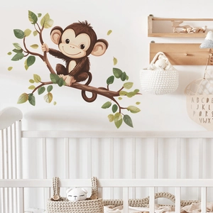 Cartoon monkey on leafy branch wall decal for nursery and kids bedroom decoration