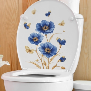 Poppy flower toilet lid decal with blue petals and golden butterflies on white ceramic