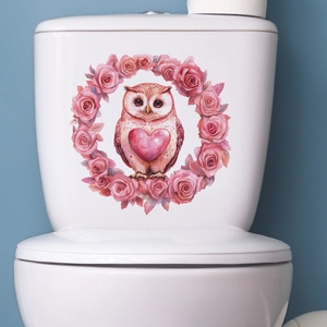 Watercolor pink owl and floral heart wreath decal applied on white toilet tank