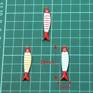 Golden stainless steel enamel fish charms with dimensions of 39mm length and 7mm width