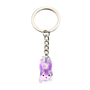 Luminous purple resin kitten pendant with silver metal keychain and glitter details