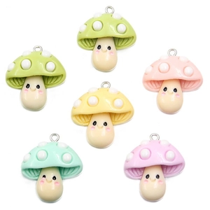 Cute resin mushroom charms with smiley faces and white polka dots in six assorted colors