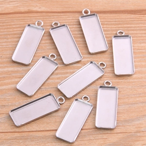 Detailed view of silver rectangular stainless steel pendant trays for DIY jewelry making