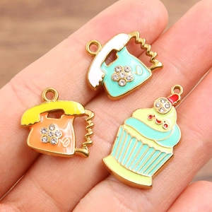 Three colorful enamel ice cream and telephone pendants with gold plating and rhinestones