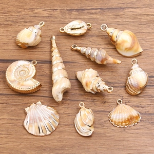 Golden acrylic sea shell charms for DIY jewelry making including starfish and conch shapes