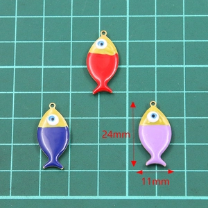 Golden stainless steel fish charms with enamel evil eye detail in three colors