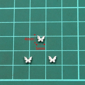 Mini dijes de mariposa 3D de metal para uñas y diseño de joyas DIY, plateado 4x5mm