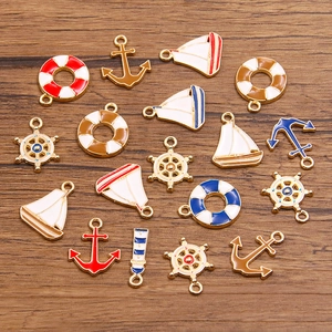 DIY nautical alloy charms set with anchor sailboat and lighthouse in KC gold finish