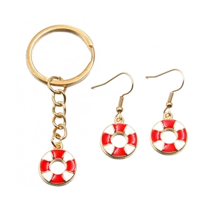 Nautical lifebuoy jewelry set with red and white enamel charms and gold-tone finish