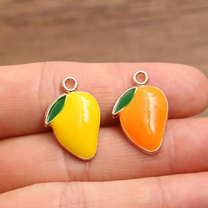 DIY colorful tropical mango charms in yellow and orange enamel with green leaf detail