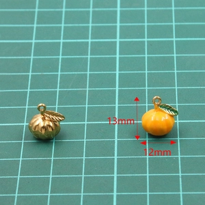 Pompoen bedeltjes van 304 roestvrij staal in goud en oranje emaille, maat 12x13mm